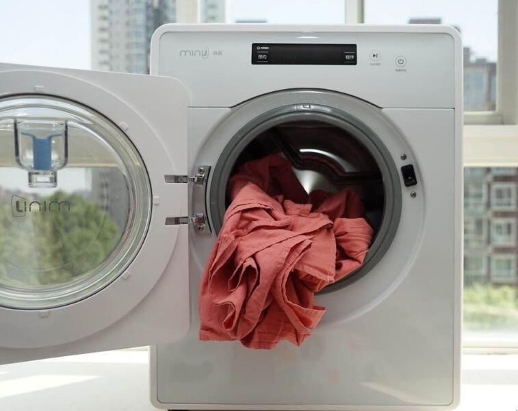 滚筒洗衣机洗衣服时震动是怎么回事